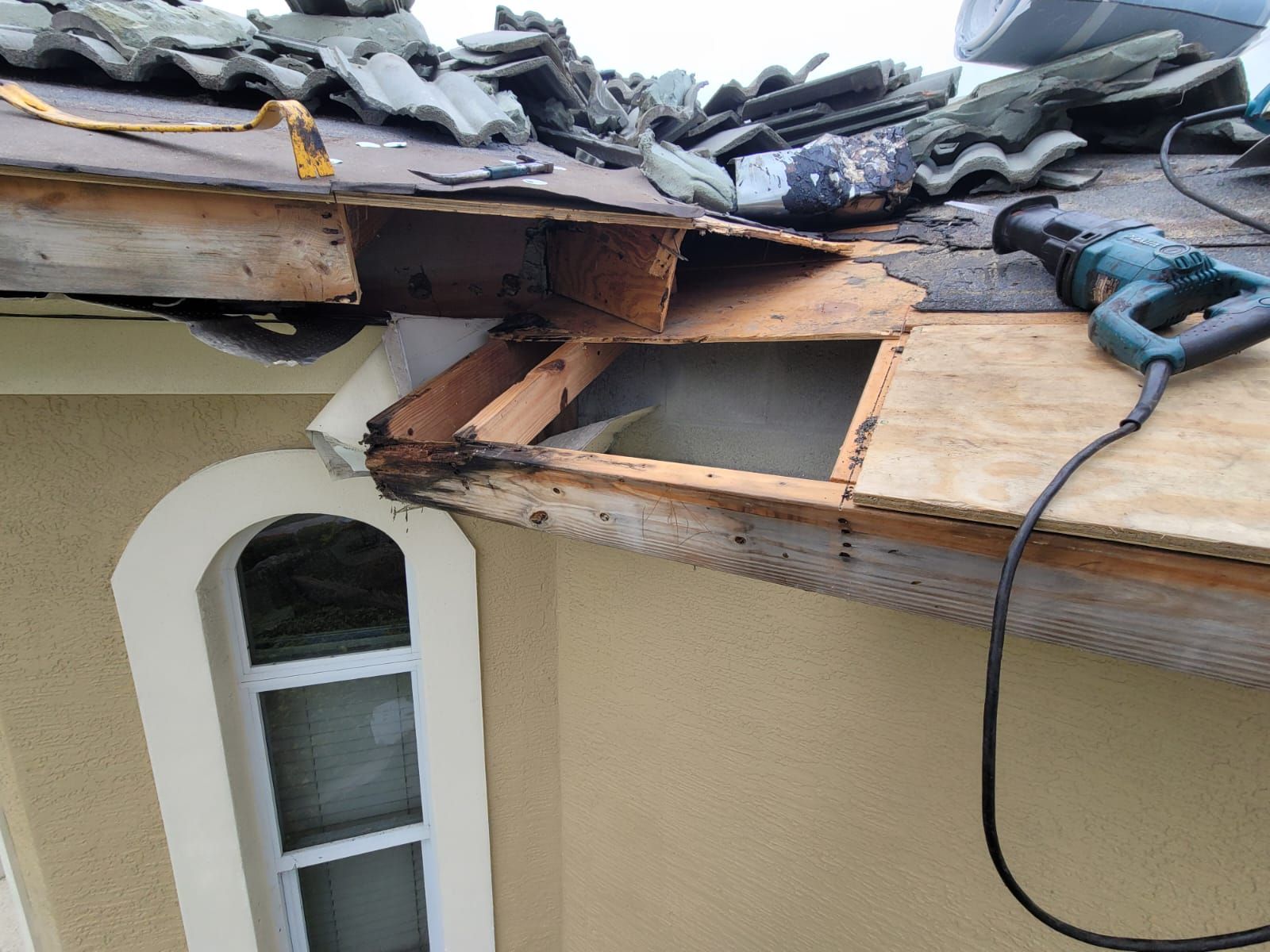 Exposed framing below a tile roof edge, Big Texas Roofing and Solar