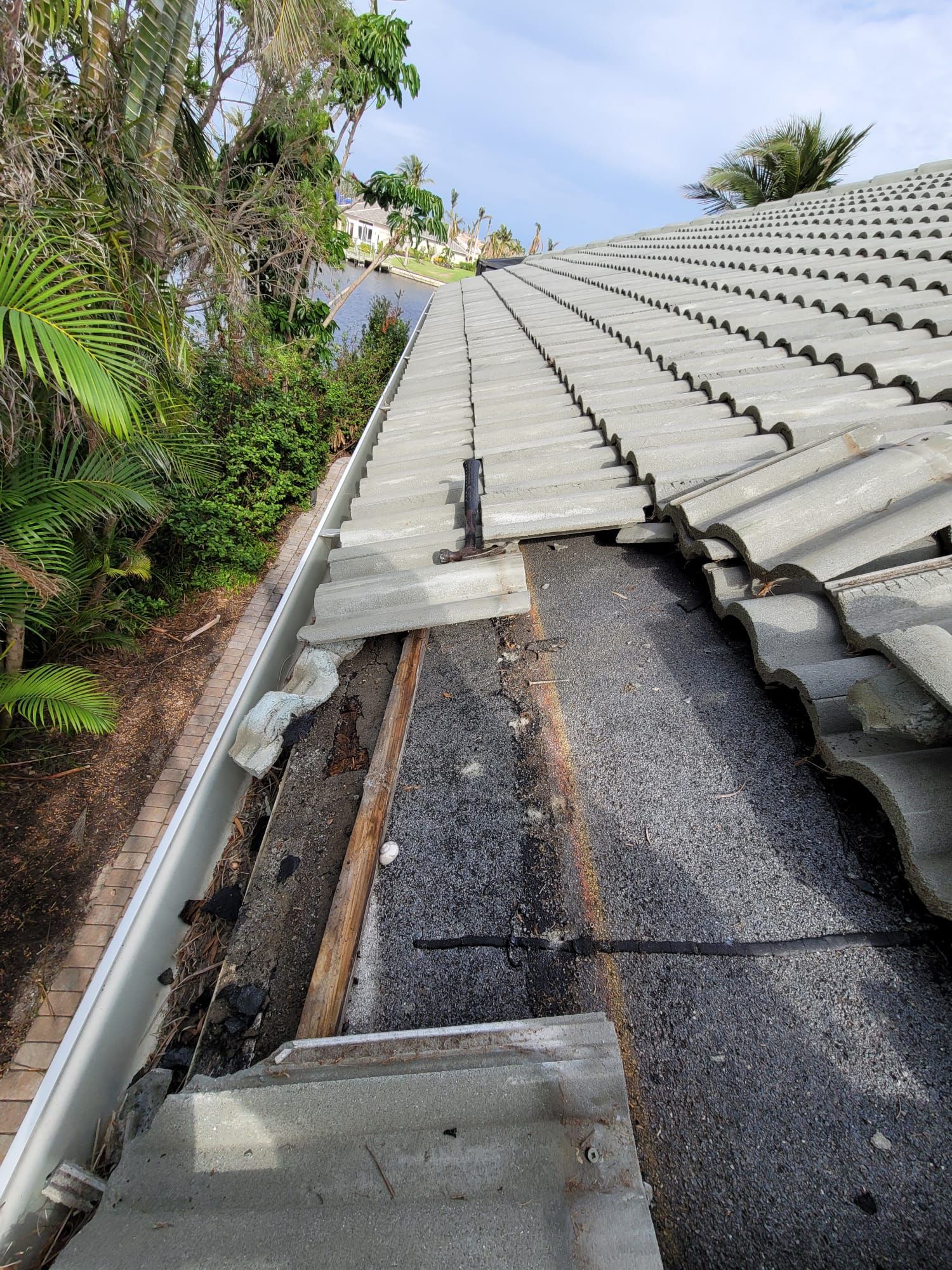 Tile roof edge opened for repairs, Big Texas Roofing and Solar
