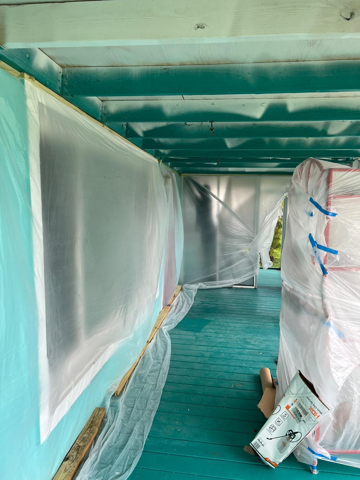 Exterior ceiling restoration with protective sheeting, Big Texas Roofing and Solar
