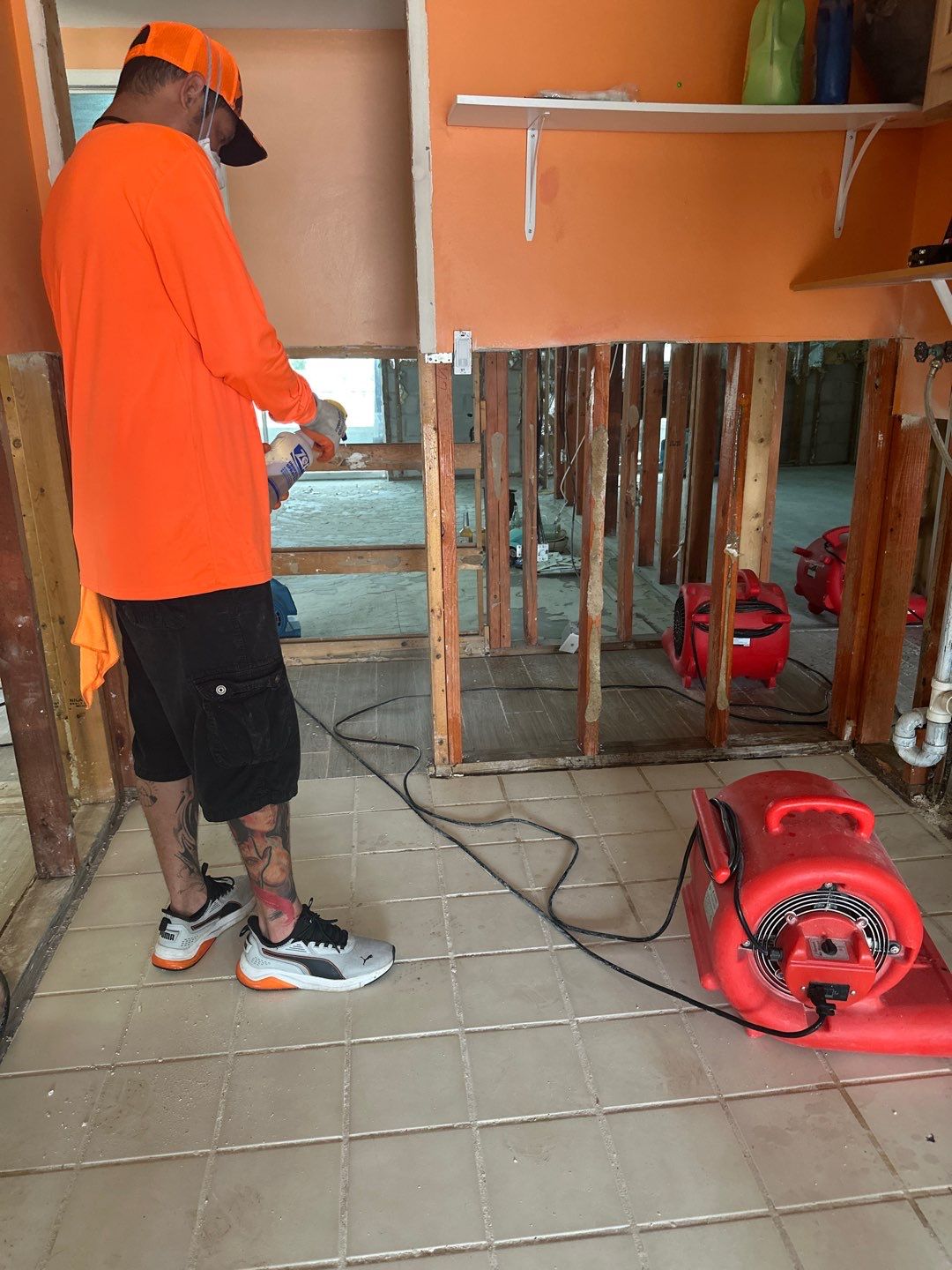 Crew member checking a room during flood restoration