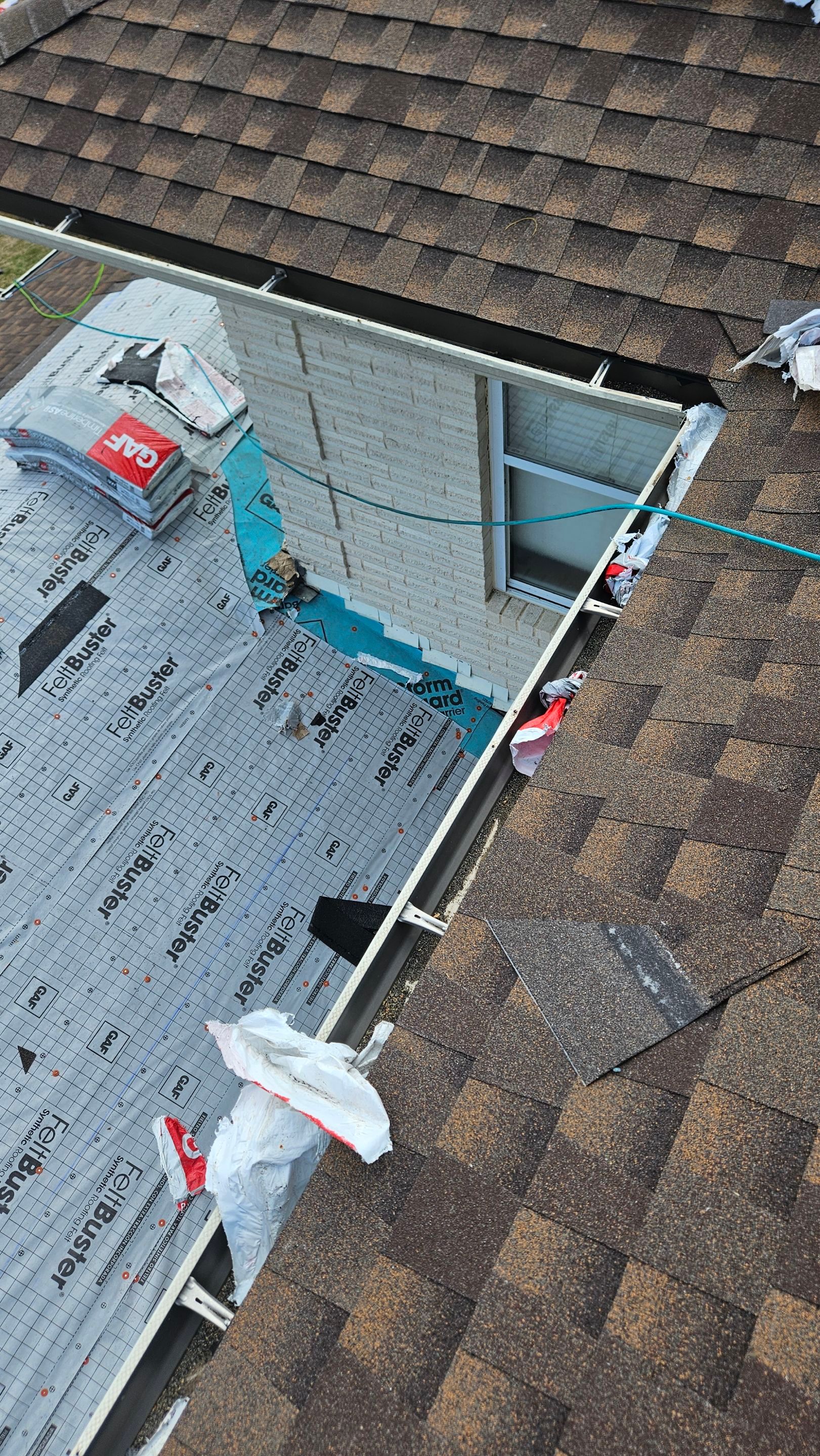 Chimney base with roof materials removed, Big Texas Roofing and Solar
