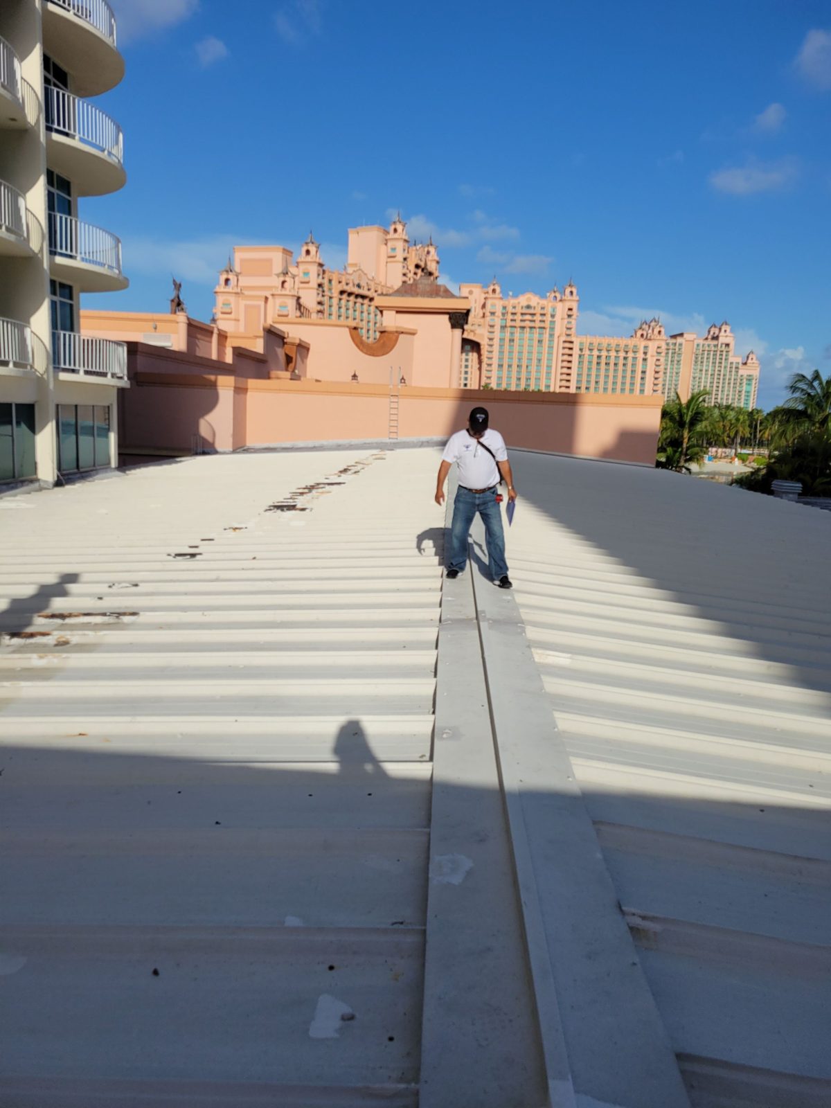 Inspector walking a metal roof section at Atlantis, Atlantis Bahamas