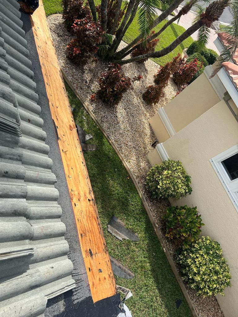 Replacement decking along a tile roof edge, Big Texas Roofing and Solar