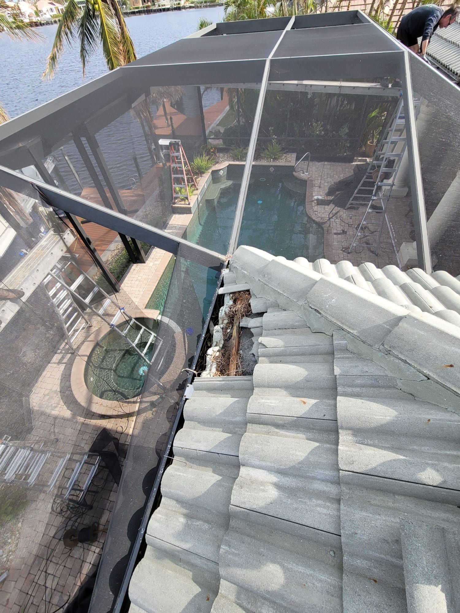Roof repair work above a screened enclosure, Big Texas Roofing and Solar