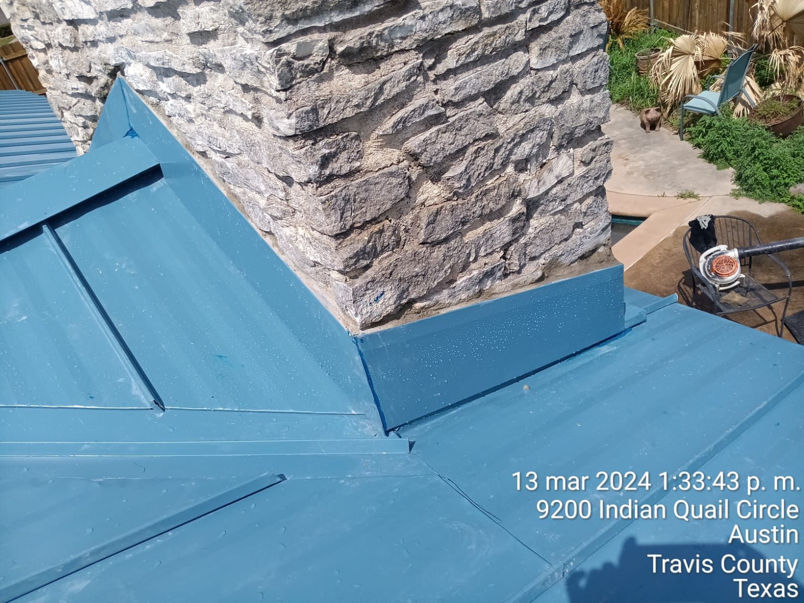 Flashing around the base of a stone chimney, Big Texas Roofing and Solar