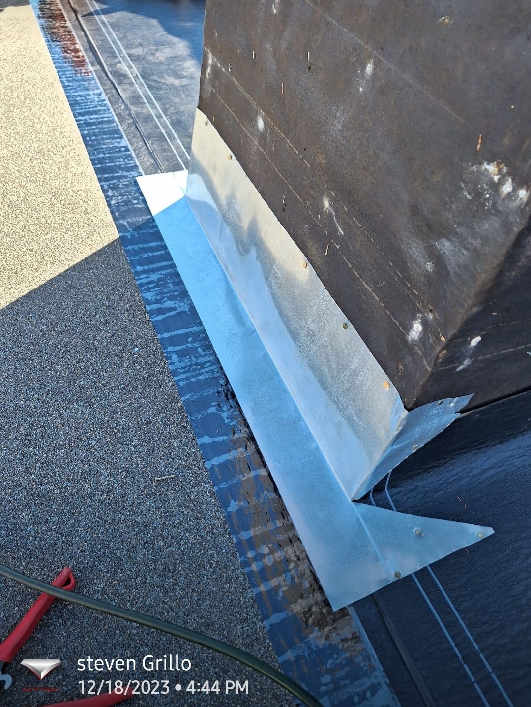 Chimney flashing detail on a shingle roof, Big Texas Roofing and Solar