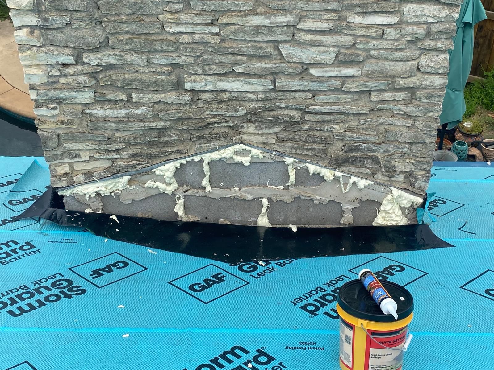 Chimney base prepared for flashing repairs, Big Texas Roofing and Solar