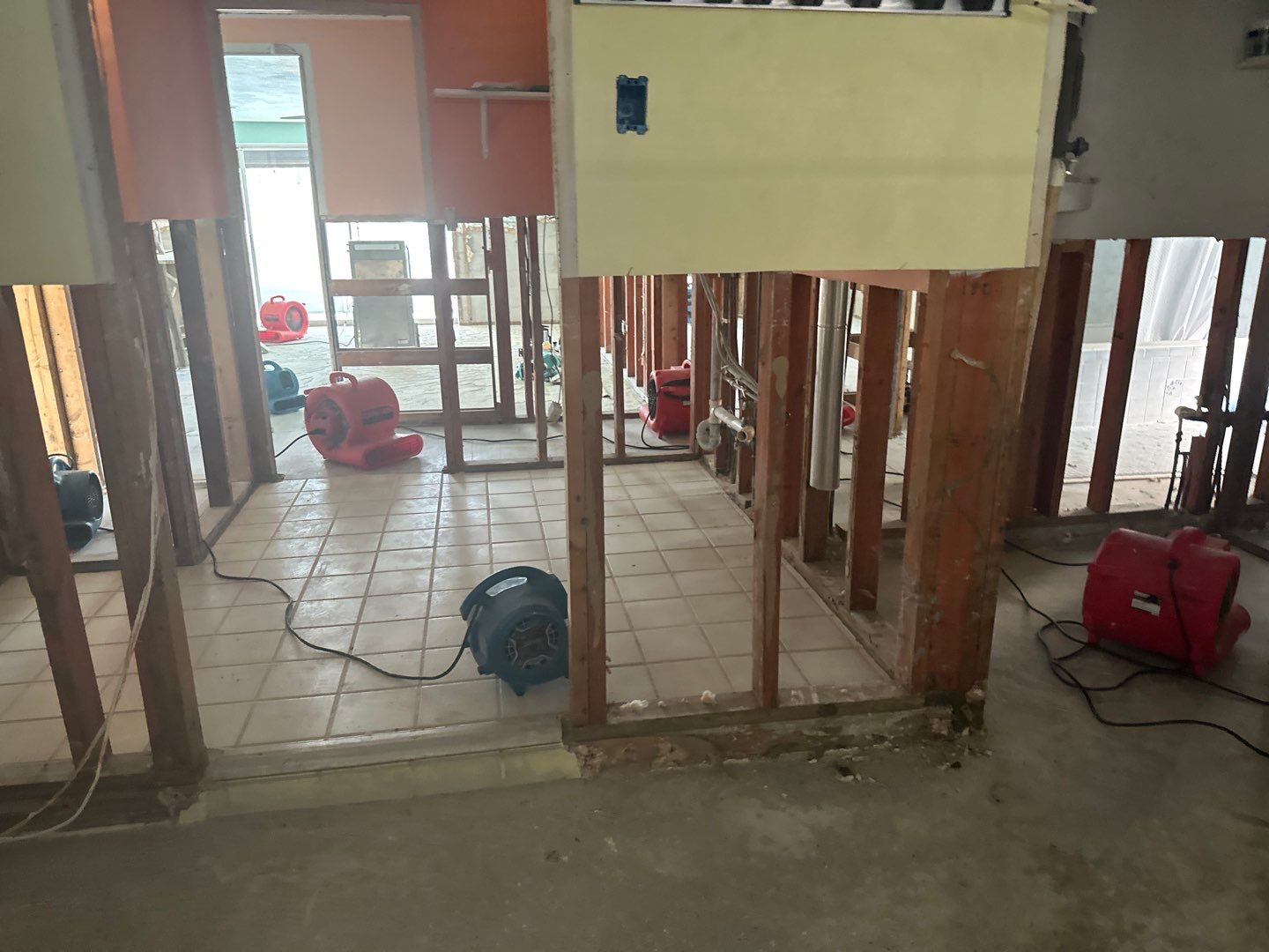 Room with damaged wall materials removed for drying