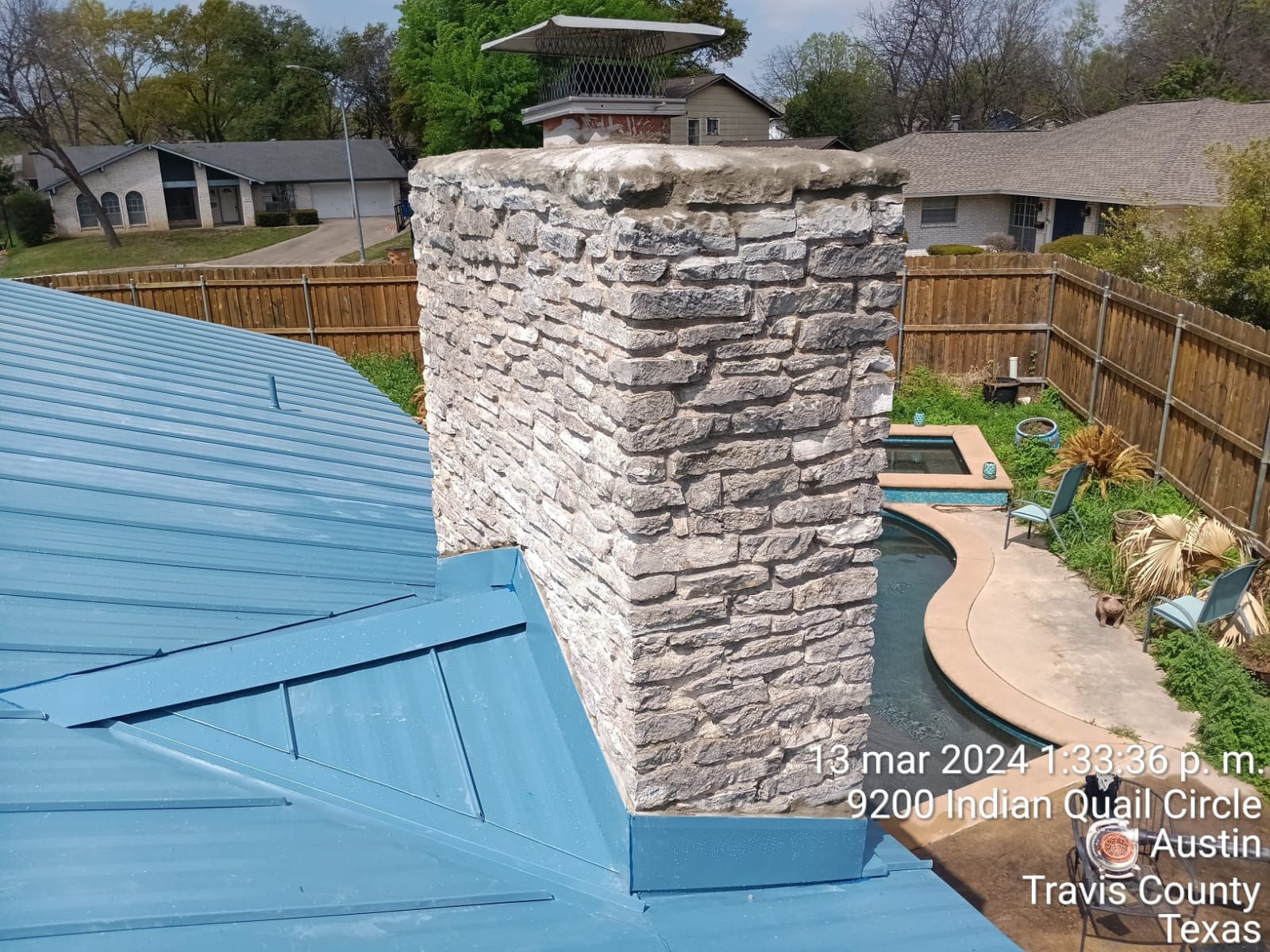 Stone chimney during roof repairs, Big Texas Roofing and Solar