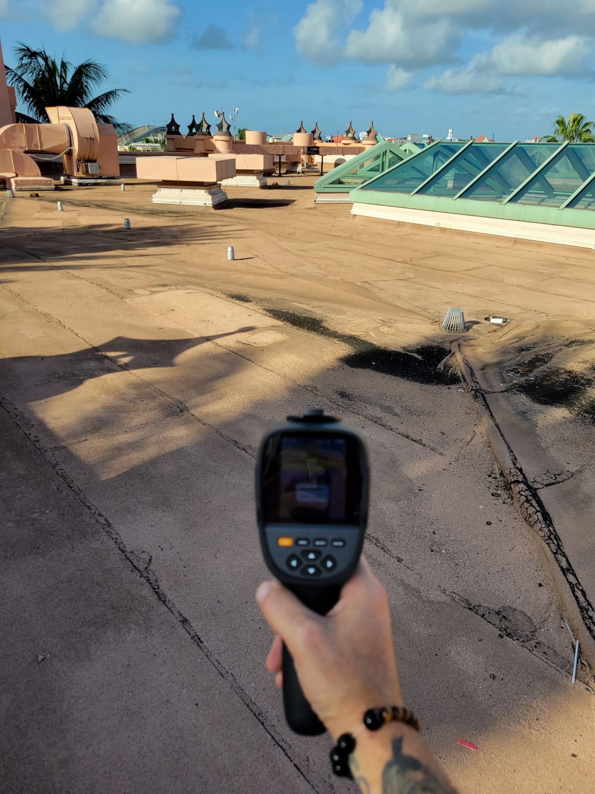 Thermal imaging camera scanning a low slope roof for trapped moisture, Atlantis Bahamas
