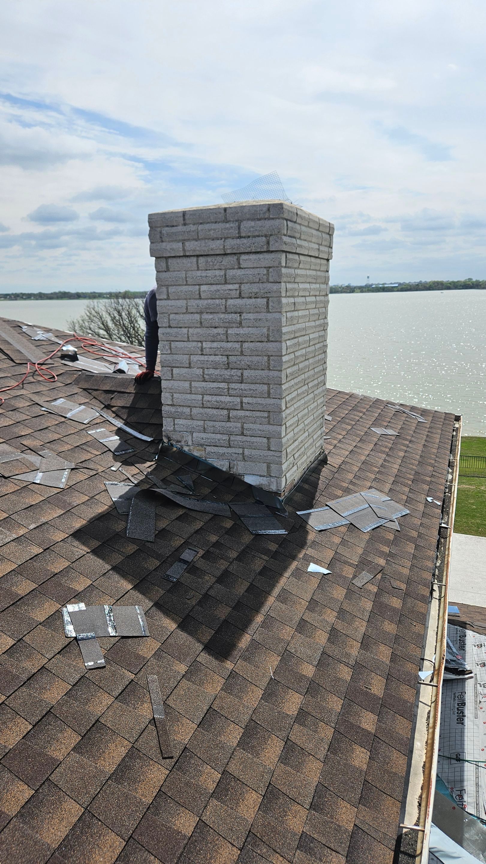 Chimney flashing on a shingle roof, Big Texas Roofing and Solar
