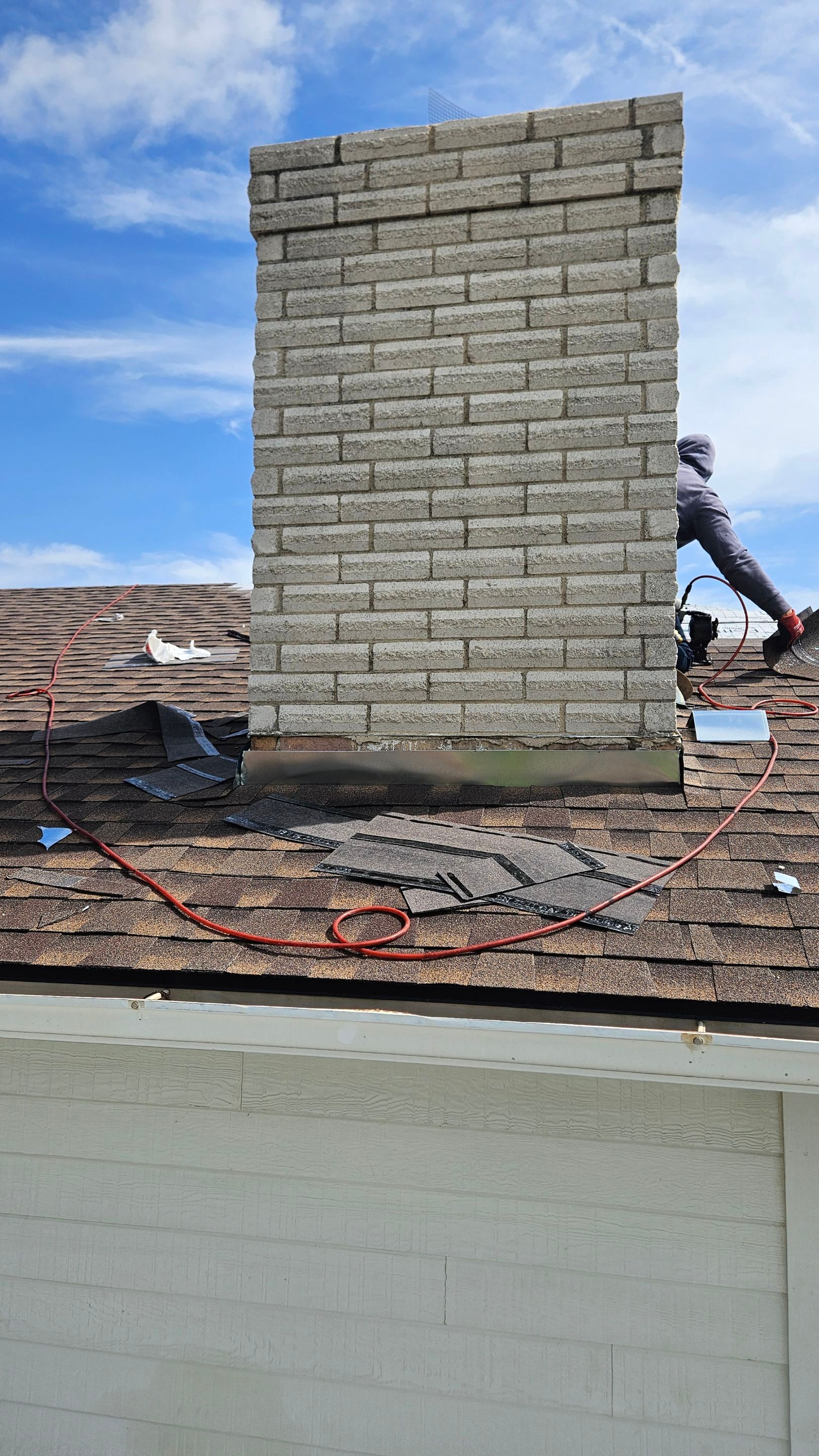 Completed chimney flashing on a shingle roof, Big Texas Roofing and Solar