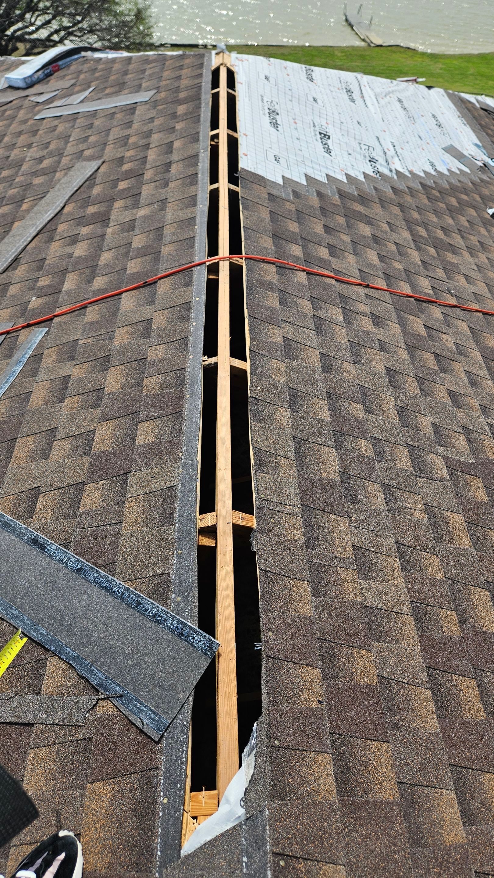 Tile roof opened along a repair area, Big Texas Roofing and Solar